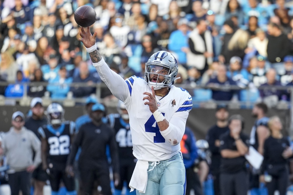 Nov 19, 2023; Charlotte, North Carolina, USA; Dallas Cowboys quarterback Dak Prescott (4) makes a throw against the Carolina Panthers during the second half at Bank of America Stadium.